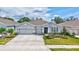A charming single-Gathering home with a well-manicured lawn, a three-car garage and stone accents at 17032 Harvest Moon Way, Bradenton, FL 34211