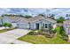 Beautifully landscaped home with a three car garage and covered entryway at 17032 Harvest Moon Way, Bradenton, FL 34211