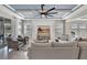 Cozy living room with stylish ceiling design, comfortable seating, and a large entertainment center at 17032 Harvest Moon Way, Bradenton, FL 34211