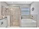 Bright main bathroom features a separate shower and tub at 17032 Harvest Moon Way, Bradenton, FL 34211