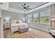 Spacious main bedroom featuring tray ceiling, large windows and an accent wall at 17032 Harvest Moon Way, Bradenton, FL 34211