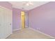 Bedroom featuring closet with sliding mirror doors and a ceiling fan at 1831 Burgos Dr, Sarasota, FL 34238