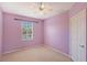 Carpeted bedroom with window view and ceiling fan at 1831 Burgos Dr, Sarasota, FL 34238