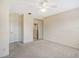 Bright bedroom with neutral carpet, ceiling fan, and closet for storage solutions at 1831 Burgos Dr, Sarasota, FL 34238