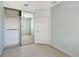Bedroom with sliding door mirrored closet at 1831 Burgos Dr, Sarasota, FL 34238