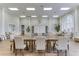 Beautiful clubhouse boasts large table, seating, and serene ambiance for gatherings at 1831 Burgos Dr, Sarasota, FL 34238