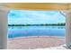 Beautiful lake view from the covered patio, offering serene outdoor enjoyment at 1831 Burgos Dr, Sarasota, FL 34238