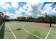 Well-maintained tennis and basketball courts available for residents, set against a sunny sky at 1831 Burgos Dr, Sarasota, FL 34238