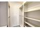 Spacious walk-in closet provides ample storage with shelving and rods for organization at 1831 Burgos Dr, Sarasota, FL 34238