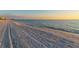 Scenic beach view featuring soft sand, clear water, and a distant skyline at 1857 Jasmine Dr, Sarasota, FL 34239