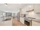 Open kitchen design with stainless steel appliances and an island at 1857 Jasmine Dr, Sarasota, FL 34239