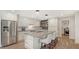 Modern kitchen features an island with seating and stainless steel appliances at 1857 Jasmine Dr, Sarasota, FL 34239