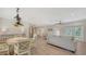 Open-concept living area with dining space flowing into a comfortable living room, bright and airy at 1857 Jasmine Dr, Sarasota, FL 34239