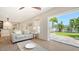 Comfortable living room with sliding glass doors offering seamless access to a beautifully landscaped backyard at 1857 Jasmine Dr, Sarasota, FL 34239
