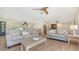Bright living room featuring an open floor plan with modern furnishings and views into the kitchen at 1857 Jasmine Dr, Sarasota, FL 34239