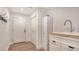 Convenient mudroom entrance with utility sink, built-in storage, and tile flooring at 1857 Jasmine Dr, Sarasota, FL 34239