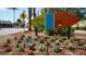 Colorful Siesta Key Village sign surrounded by blooming flowers and lush greenery at 1857 Jasmine Dr, Sarasota, FL 34239