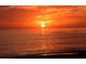 A breathtaking sunset over the ocean, casting a warm golden glow on the tranquil water at 1857 Jasmine Dr, Sarasota, FL 34239