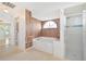Bathroom with large soaking tub, separate shower, and modern finishes at 2136 Bendway Dr, Port Charlotte, FL 33948