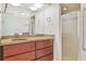 Updated bathroom with vanity, granite counters, and a glass-enclosed shower at 2136 Bendway Dr, Port Charlotte, FL 33948