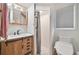 Modern bathroom features a vanity with a vessel sink and a walk-in shower at 2136 Bendway Dr, Port Charlotte, FL 33948