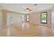 Bright bedroom featuring bamboo flooring, multiple windows, and a ceiling fan at 2136 Bendway Dr, Port Charlotte, FL 33948