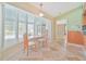 Cozy breakfast nook with large windows and views of the pool at 2136 Bendway Dr, Port Charlotte, FL 33948