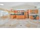 Well-appointed kitchen with wood cabinets, black appliances, and a functional island for food preparation at 2136 Bendway Dr, Port Charlotte, FL 33948