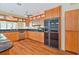 Bright kitchen featuring wood cabinets, stainless steel appliances, and granite countertops at 2136 Bendway Dr, Port Charlotte, FL 33948