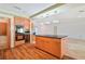 Alternate angle of the kitchen featuring a built-in oven, wine rack and kitchen island cooktop at 2136 Bendway Dr, Port Charlotte, FL 33948
