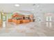 Bright living space with an open floor plan, seamlessly blending the kitchen, dining, and seating areas at 2136 Bendway Dr, Port Charlotte, FL 33948