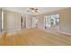 Open living area with bamboo floors, sliding glass doors, and access to outdoor patio at 2136 Bendway Dr, Port Charlotte, FL 33948