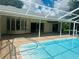 Beautiful in-ground pool with screened-in lanai and relaxing outdoor space at 2136 Bendway Dr, Port Charlotte, FL 33948