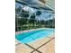 Inviting screened-in pool area with clear blue water and ample space for relaxation and outdoor enjoyment at 2136 Bendway Dr, Port Charlotte, FL 33948