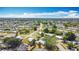 Aerial view shows a residential neighborhood with single-Gathering homes and mature trees under a sunny sky at 21966 Belinda Ave, Port Charlotte, FL 33952