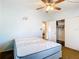 Bedroom features standard closet, neutral paint, carpet, ceiling fan, and a twin bed at 21966 Belinda Ave, Port Charlotte, FL 33952
