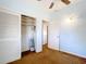 Bedroom features neutral paint, standard closet with louvred doors and flush ceiling fan at 21966 Belinda Ave, Port Charlotte, FL 33952