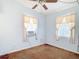 This bedroom has light blue walls, an AC unit and bright natural lighting at 21966 Belinda Ave, Port Charlotte, FL 33952