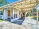 Large carport with screen wall, offering sheltered parking and outdoor space at 21966 Belinda Ave, Port Charlotte, FL 33952