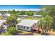 Backyard exterior view with trees surrounding the home at 21966 Belinda Ave, Port Charlotte, FL 33952