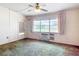 Bright living room with large window, offering an inviting space to relax at 21966 Belinda Ave, Port Charlotte, FL 33952