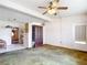 Spacious living room with a vintage china cabinet, neutral walls, and a ceiling fan at 21966 Belinda Ave, Port Charlotte, FL 33952