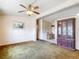 Open living room with neutral walls, classic ceiling fan, and vintage accents at 21966 Belinda Ave, Port Charlotte, FL 33952