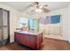 This office contains a ceiling fan, carpet and window AC unit at 21966 Belinda Ave, Port Charlotte, FL 33952