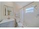 Clean bathroom featuring tiled shower with glass and updated vanity at 2226 Fairfield Ave, Sarasota, FL 34232