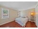Bright bedroom featuring hardwood floors, large windows, and comfortable decor at 2226 Fairfield Ave, Sarasota, FL 34232