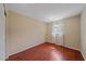 Bright bedroom featuring hardwood floors and large window at 2226 Fairfield Ave, Sarasota, FL 34232