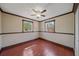 Bedroom featuring hardwood floors and two windows at 2226 Fairfield Ave, Sarasota, FL 34232