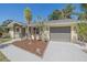 Charming single-story home with a well-manicured lawn and a neutral color palette at 2226 Fairfield Ave, Sarasota, FL 34232