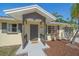 Charming home featuring a covered front porch, fresh landscaping, and an inviting entryway at 2226 Fairfield Ave, Sarasota, FL 34232